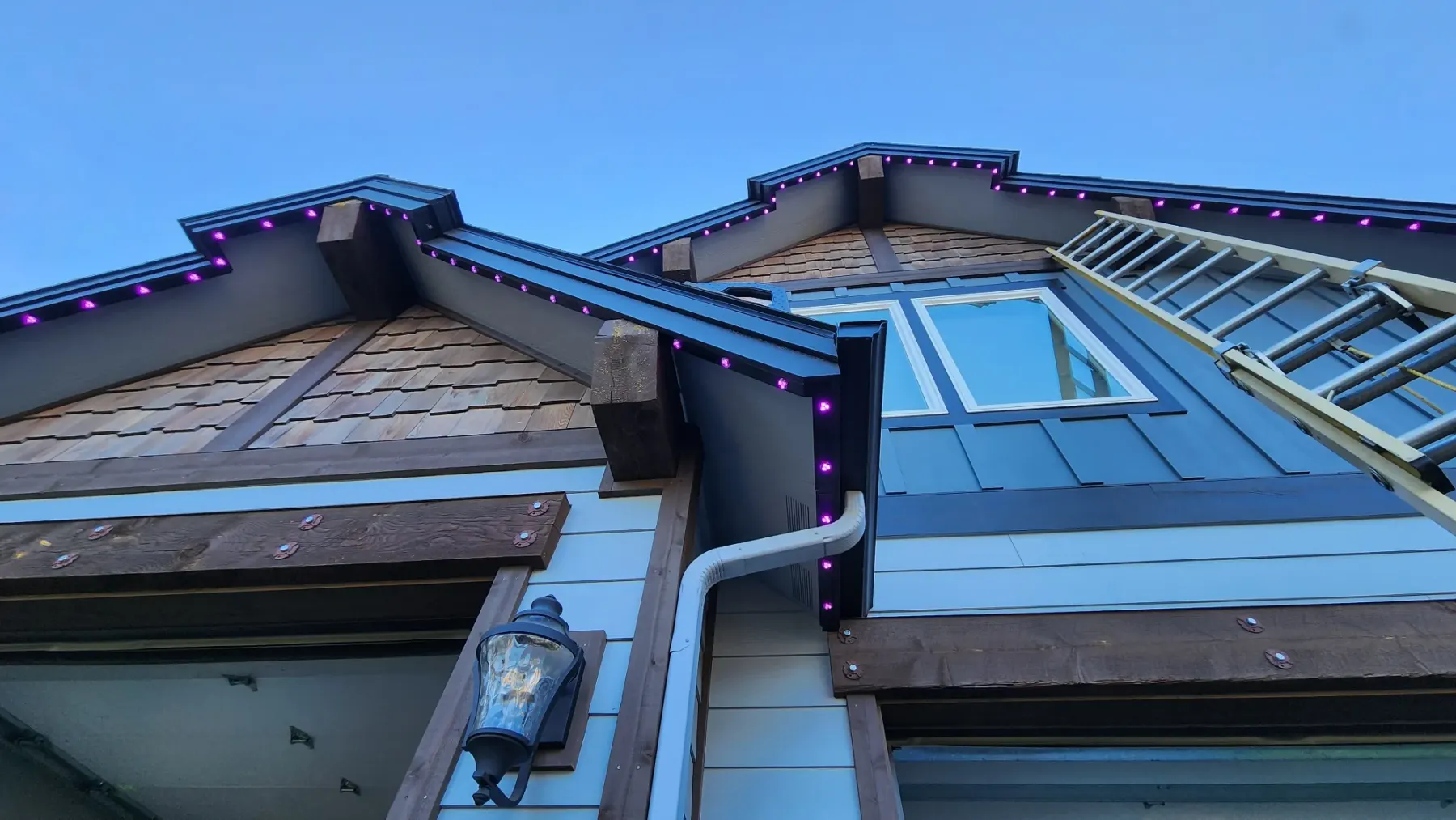 Daytime close-up of 12V LED pucks in a white soffit track