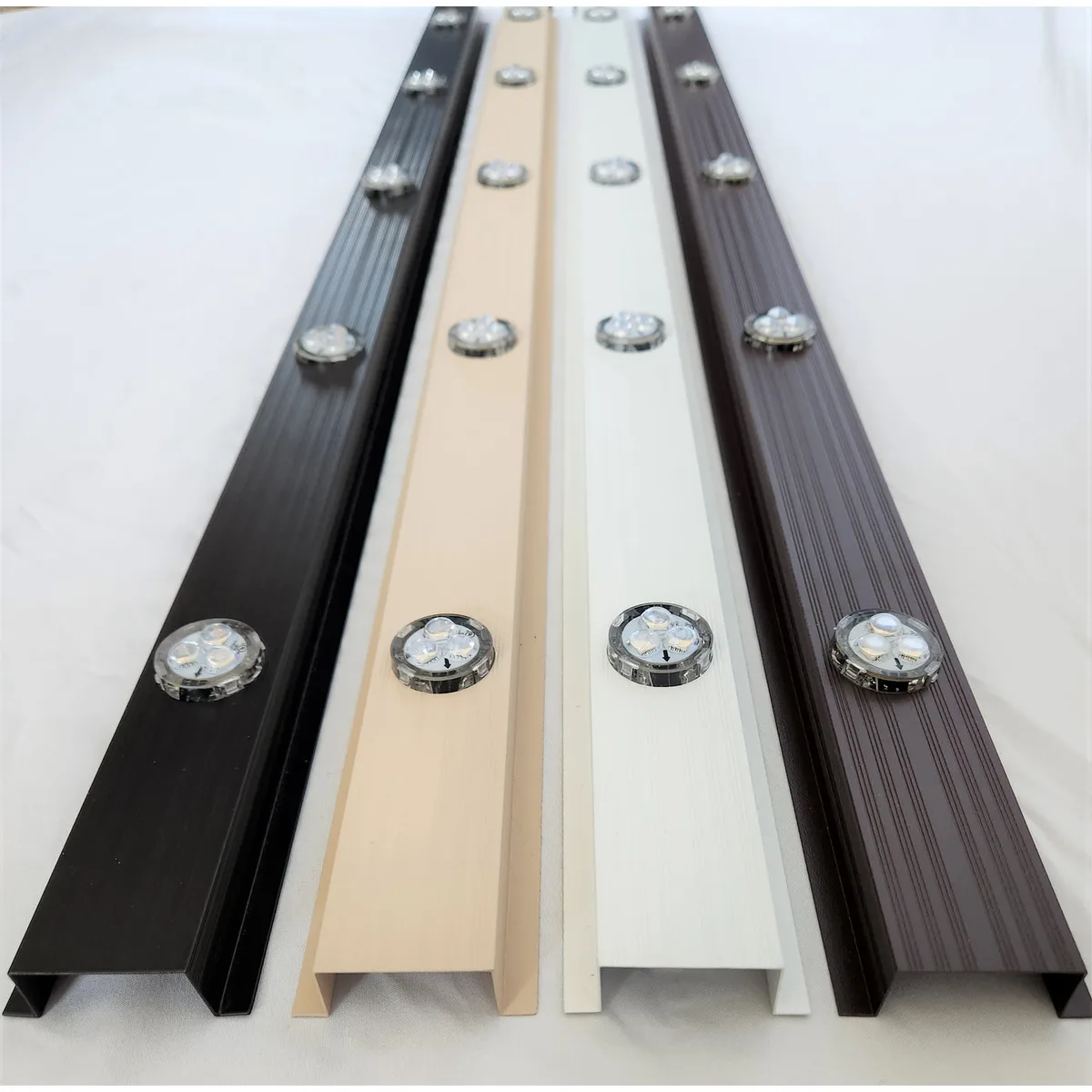 Black, wicker and white aluminum lighting track with pucks