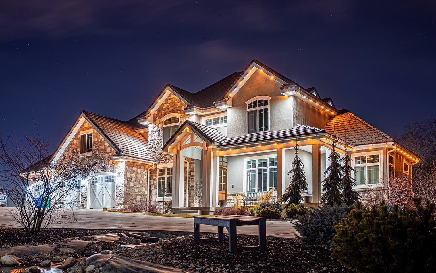 Home with Illumi Track Lights set to security mode at night